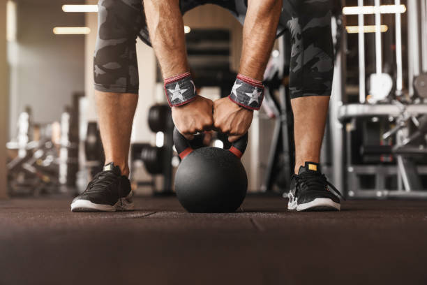 istock Close up photo of man strength workout training with dumbbells 1208410085