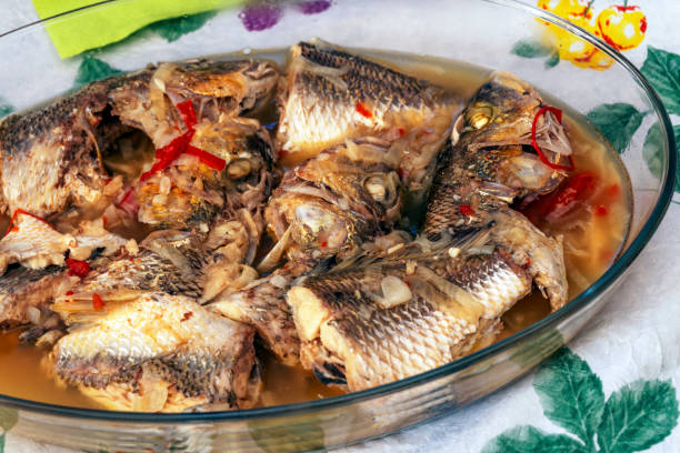 istock Delicious baked fish with onion and pepper 1208410102