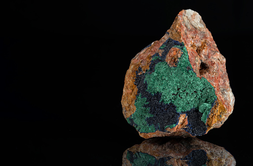 Brushes of dark blue azurite crystals with bright green malachite from Morocco.
