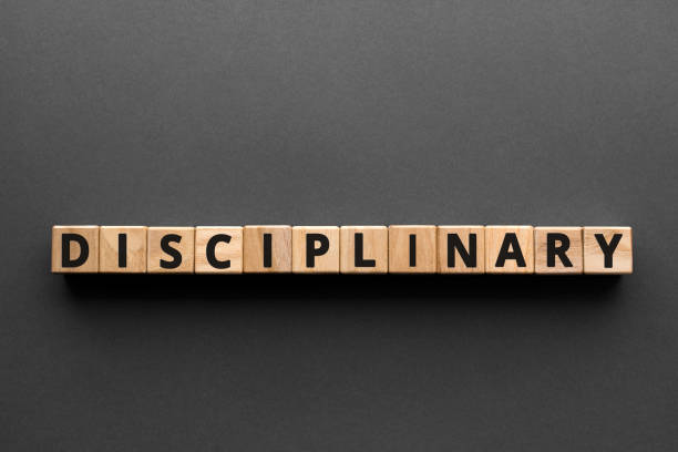 Disciplinary - words from wooden blocks with letters stock photo