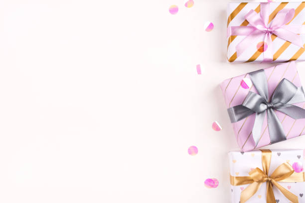 istock Set of gift boxes with bows and confetti on a white background. 1208414792