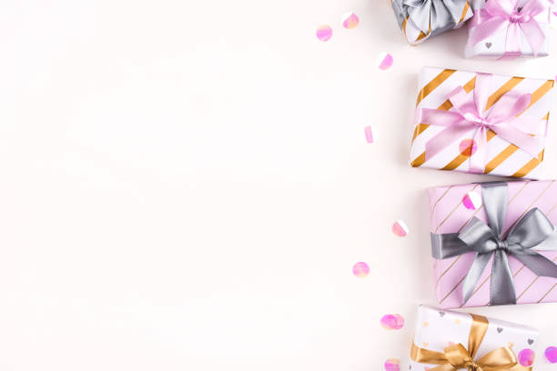istock Set of gift boxes with bows and confetti on a white background. 1208414795