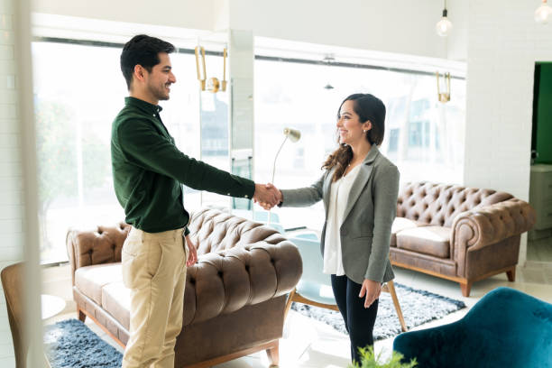 istock Businessman Greeting New Employee At Office 1208415792
