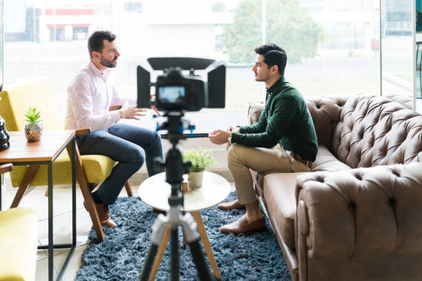 istock Reporter With Businessman During Office Interview 1208416173