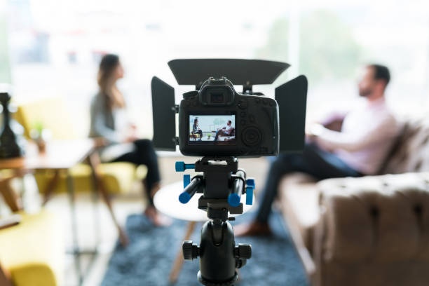istock Journalist With Businessman Recorded In Video Camera 1208416222