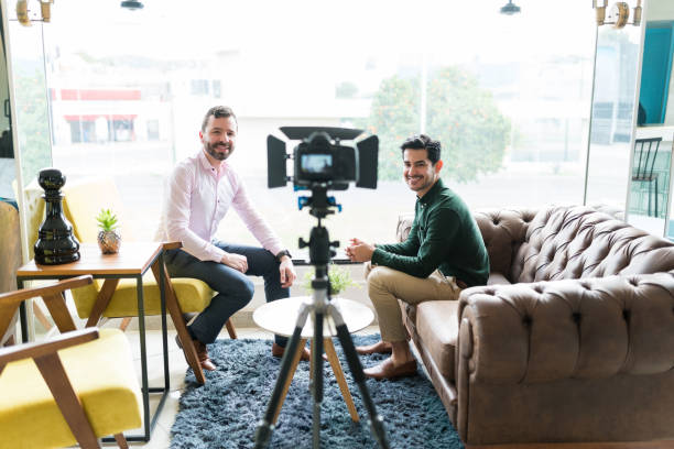 istock Reporter Recording Interview With Businessman In Office 1208416256