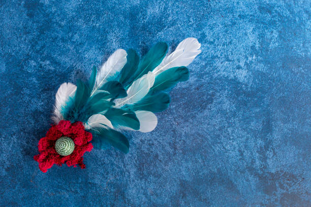 istock Decorative easter eggs in nest and feathers. Dark blue background. Holiday decorations, Easter concept background. 1208417119