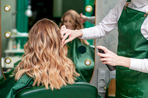 istock Hairdresser makes hairstyle. 1208417187
