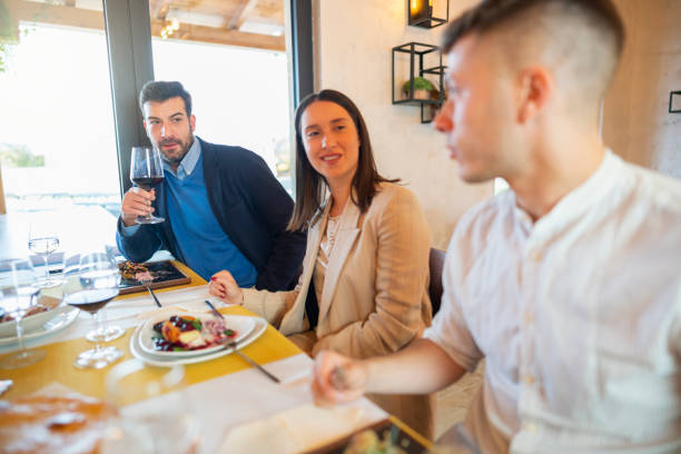 istock Friendship at the restaurant table 1208417437