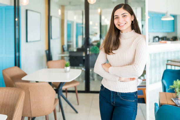 istock Young Woman Is Confident At Workplace 1208417746
