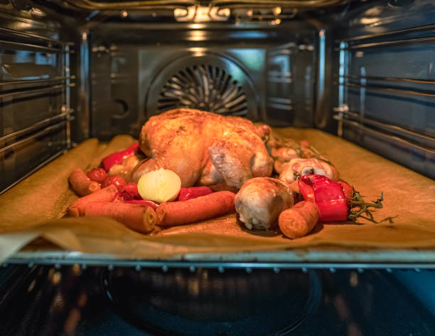 appetizing roast chicken with vegetables in the oven.