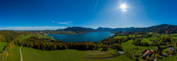istock Fantastic panoramic view over the bavarian lake Tegernsee in autumn with fall colors, made by a drone. 1208417931