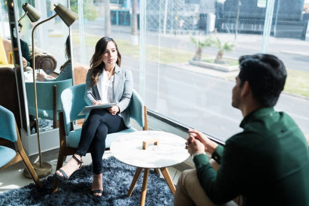istock Psychologist With Young Man During Therapy Session 1208419798