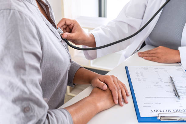 istock Doctor using a stethoscope checking patient about the problem of illness, sickness condition and recommend with examining treatment method 1208421392