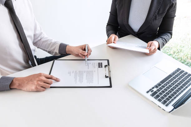 istock Businessman interview consider a resume conversation during about profile of candidate of conducting a job interview listen to answers while sitting at the working meeting in office 1208421433