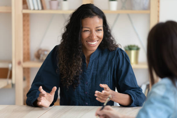 istock Smiling african american job seeker feeling relaxed on interview. 1208424248