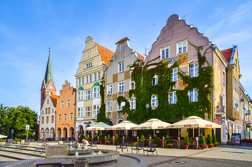 OLSZTYN, WARMIAN-MASURIAN VOIVODESHIP, POLAND - AUGUST 6, 2019: The main square of Olsztyn's Old Town. At the Old Town Square there are tenements, which were mostly destroyed by the Soviet Army in February 1945 after conquering the city. Today there are numerous shops and restaurants.