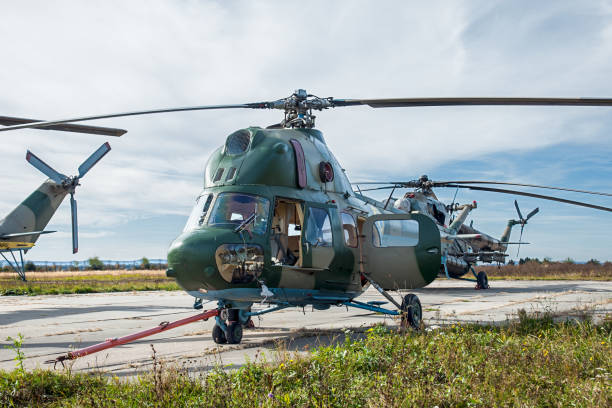 istock group of helicopters on military air base 1208427273