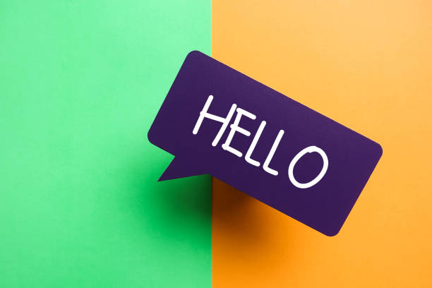 istock Hello Purple Speech Bubble On Green and Orange Background 1208427345