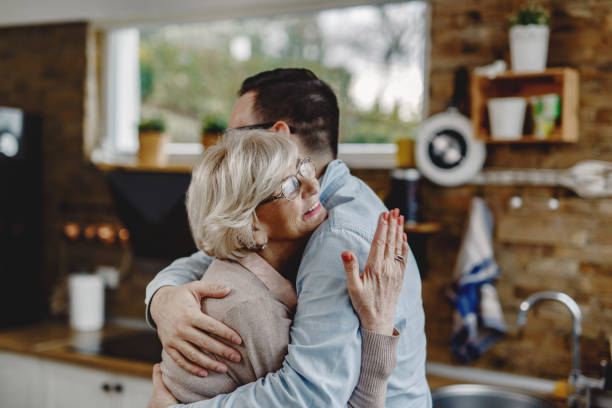 お帰りなさい息子! - two parent family indoors home interior domestic kitchen ストックフォトと画像