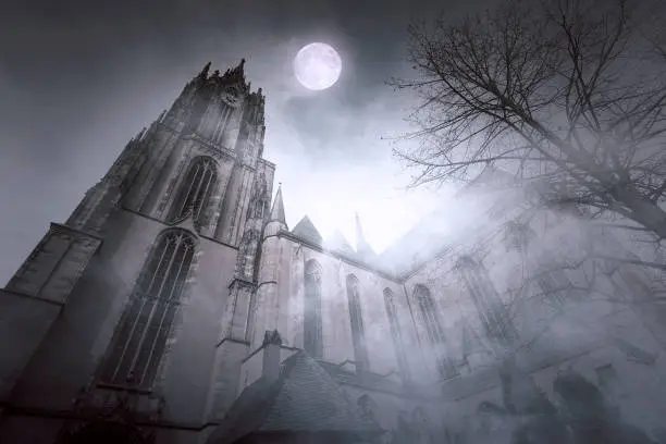 Photo of Old gothic Church with Moonlight and foggy Night in Frankfurt in Germany