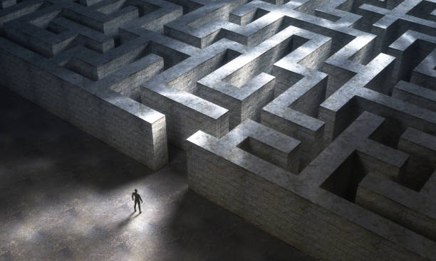 istock Small man entering a huge mysterious maze. 3d rendering 1208430426
