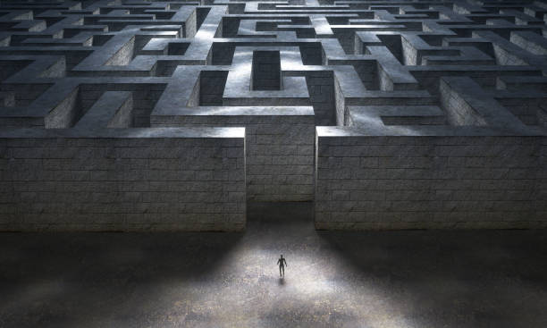 istock Small man entering a huge mysterious maze. 3d rendering 1208430441