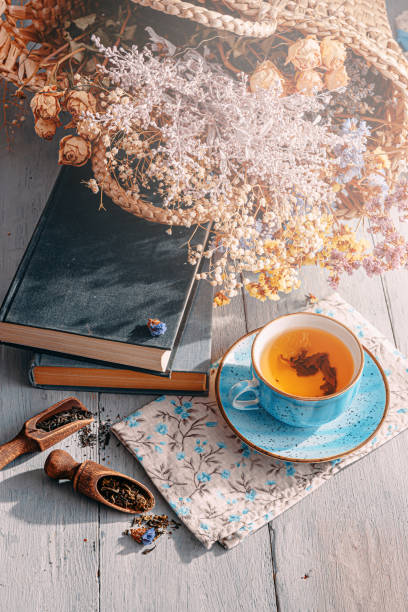 istock warm tea and a book in the sunshine 1208431584
