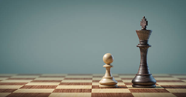 istock Pawn and king on a chessboard 1208431627