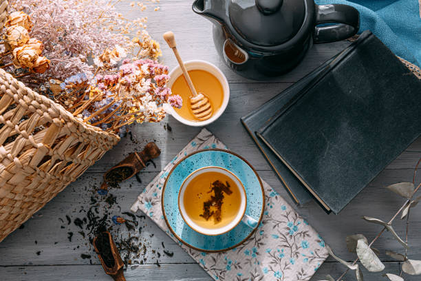 istock warm tea and a book in the sunshine 1208431632