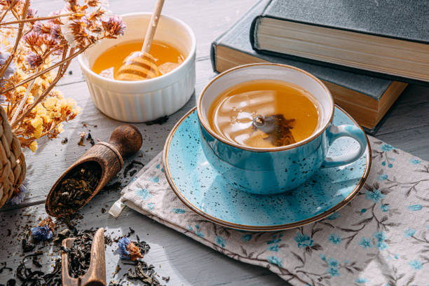 istock warm tea and a book in the sunshine 1208431637