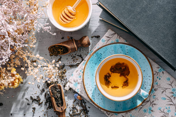 istock warm tea and a book in the sunshine 1208431698