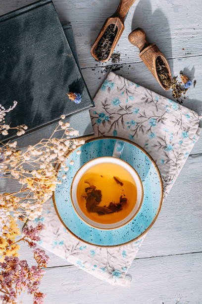istock warm tea and a book in the sunshine 1208431784