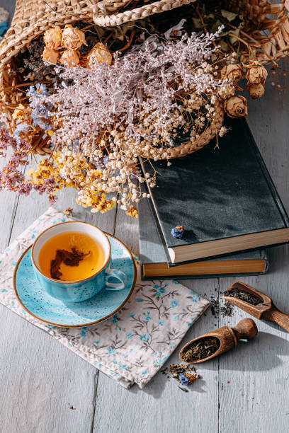 istock warm tea and a book in the sunshine 1208431814