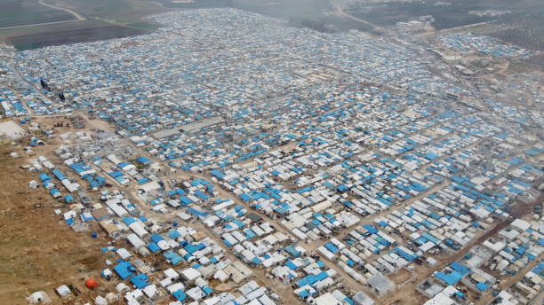 12 February 2020 Atma Refugee camp, Idlib Syria. temporary settlement on the border with Turkey. It is estimated that approximately 1 million people live. It is expected to seek asylum in Turkey. refugee camp stock pictures, royalty-free photos & images