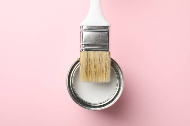 istock Paint can and brush on pink background, top view 1208436095