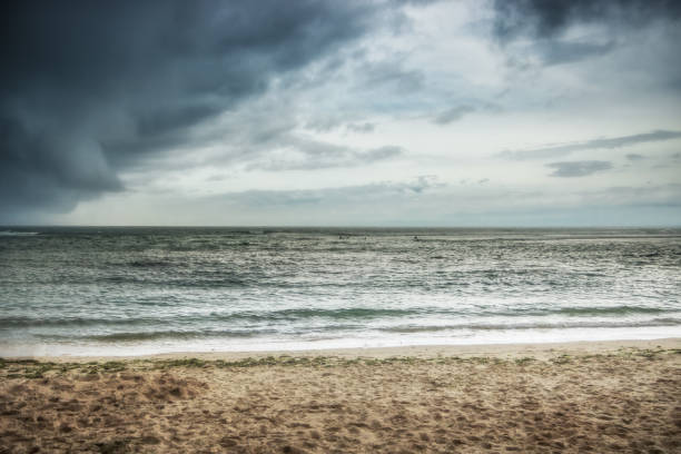 Thunder beach dramatic sky seascape Padang Padang on Bali as beautiful dramatic landscape before rain storm