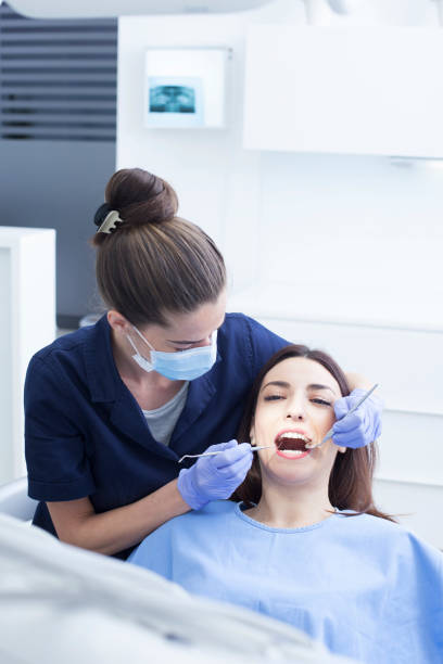 istock Female patient in the dentist's office 1208438012