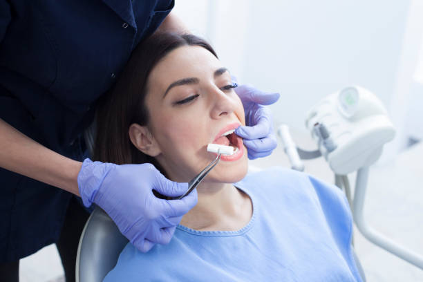 istock Female patient in the dentist's office 1208438029