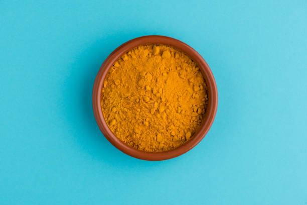istock Heap of curcuma detail 1208442572