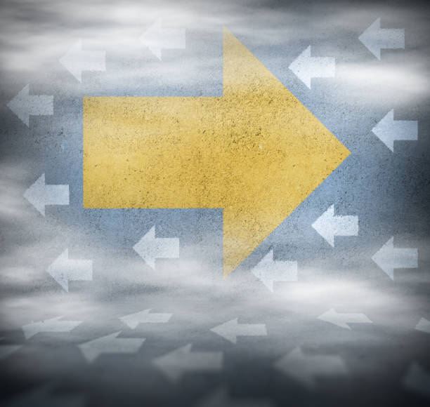 istock Arrow pointing forward against cloud of small resistance arrows 1208444351