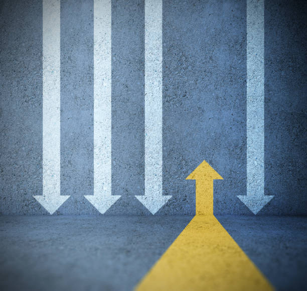 istock One single strong yellow arrow against all the others 1208444393