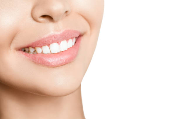istock Beautiful young woman with healthy teeth on white background 1208446749