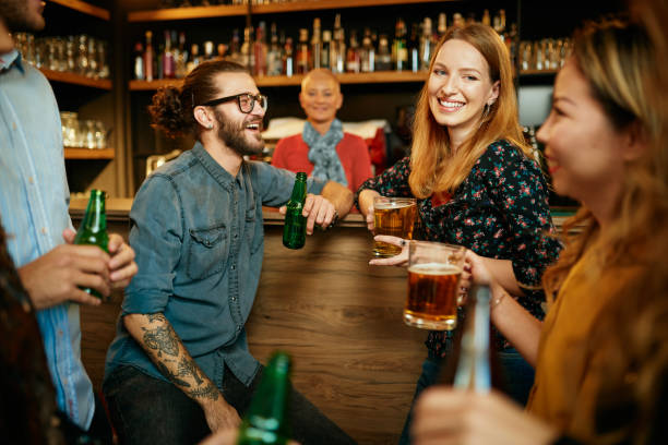 istock Friends standing in bar and toasting with beer. 1208446769