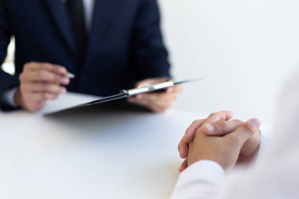 istock Business people hold resume documents, interviews for the work experience of young men applying as financial accountants for the company, Job interview and Job applicationConcept. 1208448385