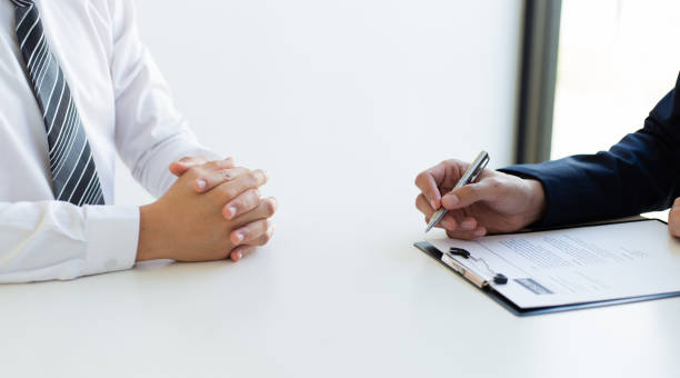 istock Business people hold resume documents, interviews for the work experience of young men applying as financial accountants for the company, Job interview and Job applicationConcept. 1208448406