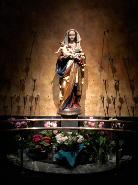 istock Virgin Mary Statue in Grotto 1208448436
