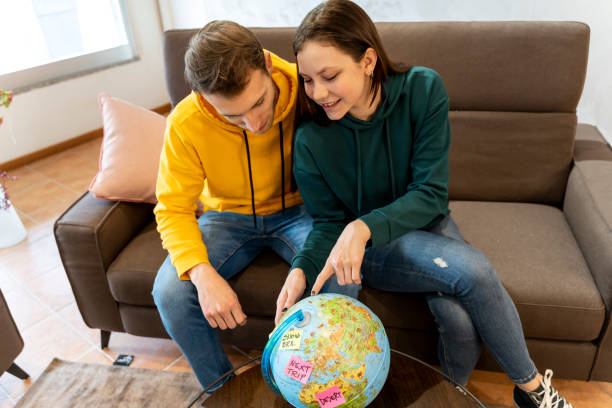 istock young couple is preparing the suitcases 1208451557