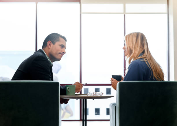 istock Coworkers or a professional and a client have a discussion 1208452804