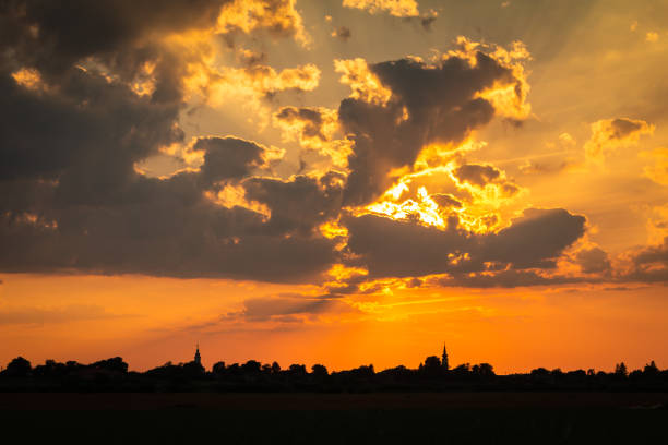 istock Colorful Sunset Setting Over Small Village 1208453073